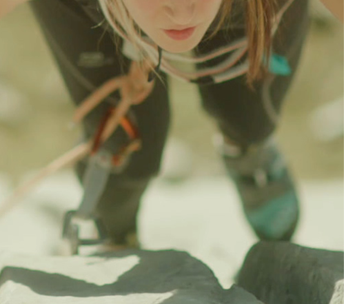 Girl climbs the rock