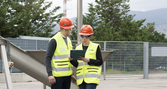 Two operators read documents